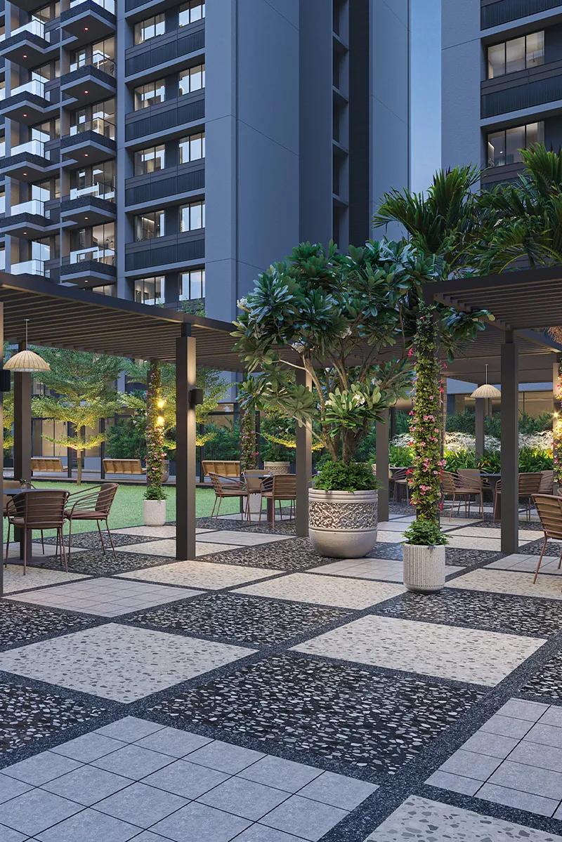 Pergola sitout with tables under a tree