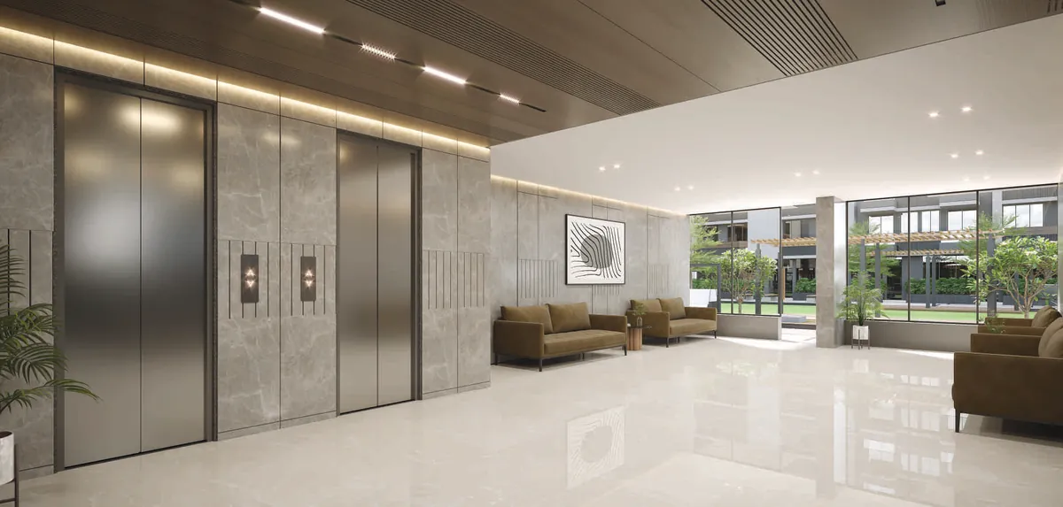 Entrance lobby with lifts and a seating corner