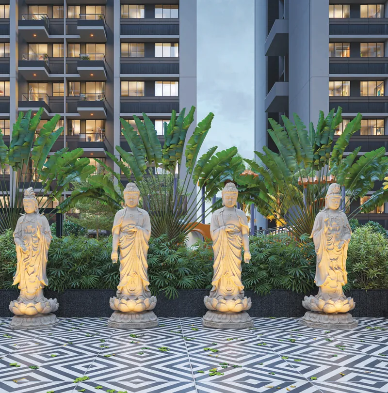 Sanctuary court with lit statues among plants